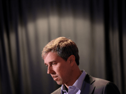 Democratic presidential candidate former U.S. Rep. Beto O'Rourke (D-TX) listens to a quest