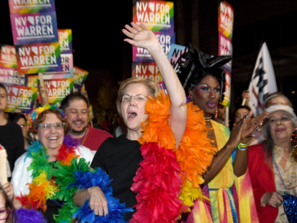 Democratic presidential candidate and U.S. Sen. Elizabeth Warren (D-MA) (C) and drag queen