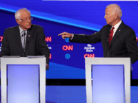 Sen. Bernie Sanders (I-VT) and former Vice President Joe Biden interact during the Democratic Presidential Debate at Otterbein University on October 15, 2019 in Westerville, Ohio. A record 12 presidential hopefuls are participating in the debate hosted by CNN and The New York Times. (Photo by Win McNamee/Getty Images)
