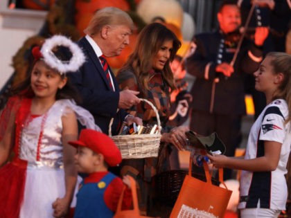 WASHINGTON, DC - OCTOBER 28: U.S. President Donald Trump and first lady Melania Trump han