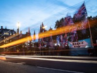 LONDON, ENGLAND - OCTOBER 29: Supporters and critics of Brexit are seen through the trails of car lights as they protest opposite the Houses of Parliament on October 29, 2019 in London, England. Prime Minister Boris Johnson has put forward a motion for a short bill proposing an early general …