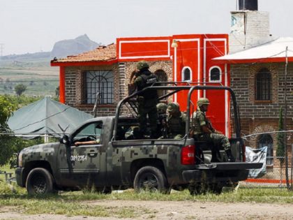 Members of the Army patrol the surroundings of the Puente Grande State prison in Zapotlane