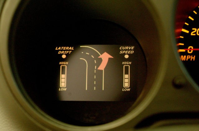 MCLEAN, VA - JUNE 24: An electronic gauge is seen next to the speedometer of a car at the