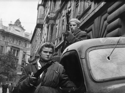 12th November 1956: A couple of Hungarian freedom fighters bearing arms in Budapest, in preparation for the Russian forces. Original Publication: Picture Post - 8730 - Hungary's Last Battle For Freedom - pub. 1956 (Photo by Jack Esten/Picture Post/Hulton Archive/Getty Images)
