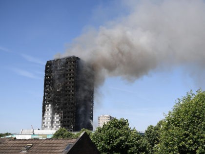 LONDON, ENGLAND - JUNE 14: Fire fighters tackle the building after a huge fire engulfed the 24 storey residential Grenfell Tower block in Latimer Road, West London in the early hours of this morning on June 14, 2017 in London, England. The Mayor of London, Sadiq Khan, has declared the …