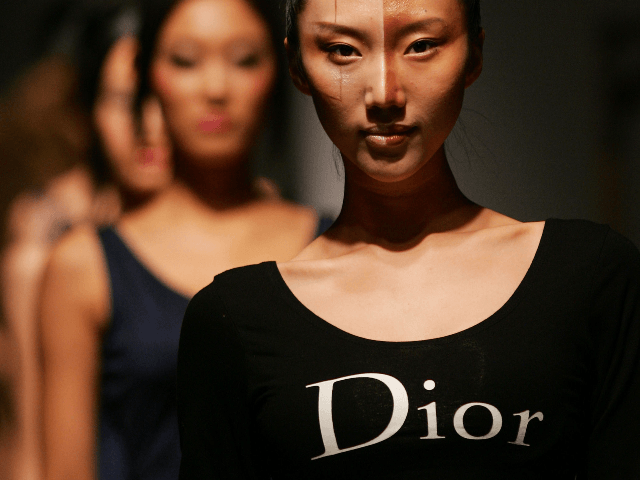 Models walk the runway during the Dior Colorful Cosmetic Fashion Show at the Zhuozhan Department Store on October 21, 2007 in Changchun of Jilin Province, China. (Photo by China Photos/Getty Images)