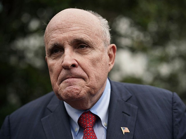 WASHINGTON, DC - MAY 30: Rudy Giuliani, former New York City mayor and current lawyer for U.S. President Donald Trump, speaks to members of the media during a White House Sports and Fitness Day at the South Lawn of the White House May 30, 2018 in Washington, DC. President Trump …