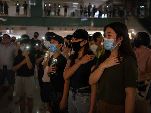 HONG KONG, CHINA - OCTOBER 12: Pro-democracy protesters sing a protest anthem during a ral