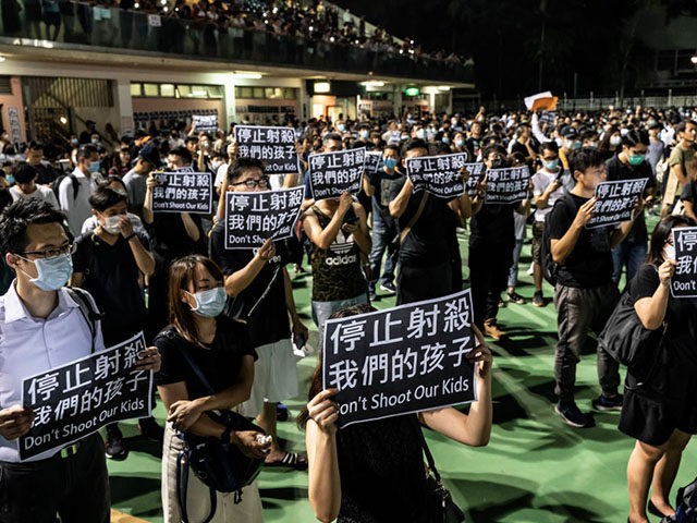 HONG KONG, CHINA - October 2: Pro-democracy protesters hold placards and sing songs as the