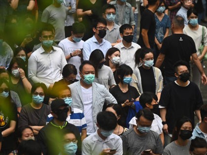 People attend a flash mob rally to show support for pro-democracy protesters in the Centra