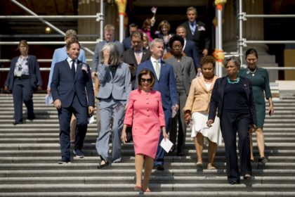 House Speaker Nancy Pelosi of Calif. and House Democrats arrive for a news conference on the first 200 days of the 116th Congress at the House east front steps on Capitol Hill, in Washington, Thursday, July 25, 2019. (AP Photo/Andrew Harnik)