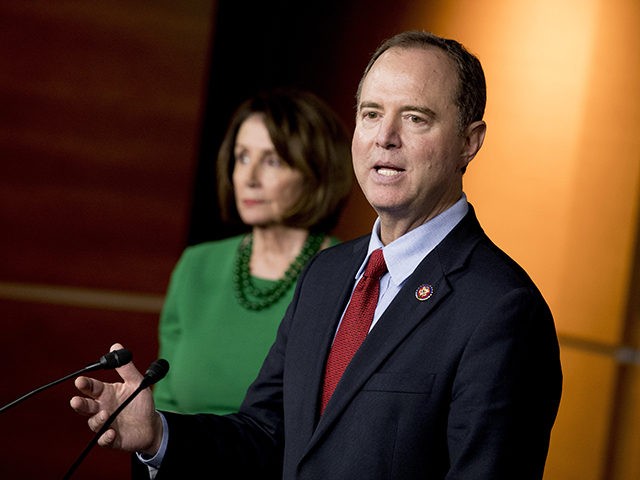 Rep. Adam Schiff, D-Calif., Chairman of the House Intelligence Committee, right, accompani