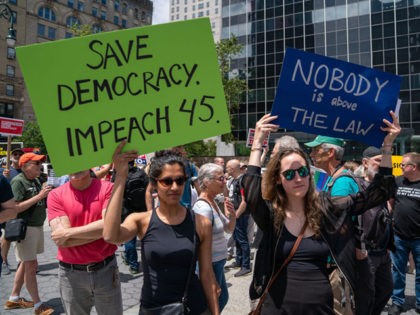 NEW YORK, NY - JUNE 15: Protestors hold signs calling for the impeachment of U.S. President Donald Trump during a demonstration on June 15, 2019 in New York City. Major cities across the country are expected to hold "#ImpeachTrump Day of Action" protests on Saturday to demand that Congress begin …