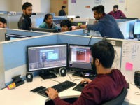 In this photo taken on January 10, 2019, employees of education technology start-up Byju's work on content development for the app at their office in Bangalore. - From a multi-billion-dollar education startup to wired-up mannequins, technology is helping to revolutionise the way Indian schoolchildren are learning -- provided their parents …