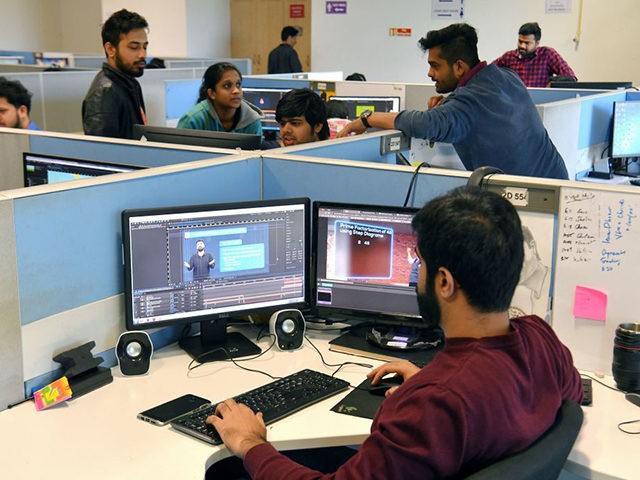 In this photo taken on January 10, 2019, employees of education technology start-up Byju's work on content development for the app at their office in Bangalore. - From a multi-billion-dollar education startup to wired-up mannequins, technology is helping to revolutionise the way Indian schoolchildren are learning -- provided their parents …