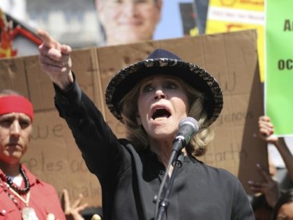 Actress and activist Jane Fonda talks to a crowd of protestors during a global climate ral