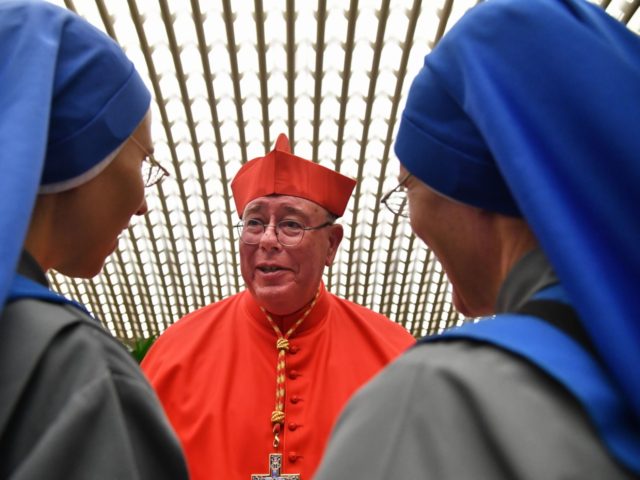 TOPSHOT - New Cardinal, Luxembourgish prelate Jean-Claude Hollerich talks with nuns as he meets with relatives and friends during a courtesy visit following his appointment by the Pope, during an Ordinary Public Consistory for the creation of new cardinals on October 5, 2019 in the Vatican. - Pope Francis appoints …