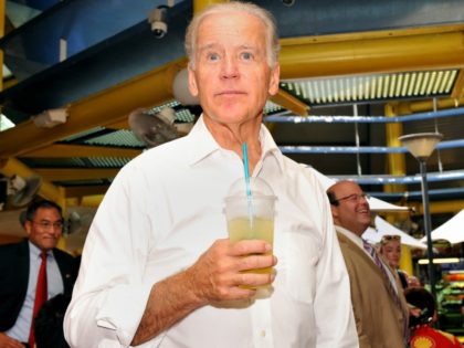 US Vice President Joe Biden enjoys a lime juice during a visit to a food court in Singapore on July 26, 2013. Biden is on a two-day official visit to Singapore after India where officials say he will tackle tensions over the disputed South China Sea "head on." AFP PHOTO …