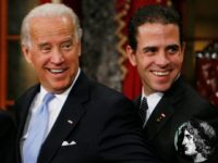 Vice President-elect, Sen. Joe Biden, D-Del., left, stands with his son Hunter during a re-enactment of the Senate oath ceremony, Tuesday, Jan. 6, 2009, in the Old Senate Chamber on Capitol Hill in Washington. (AP Photo/Charles Dharapak)