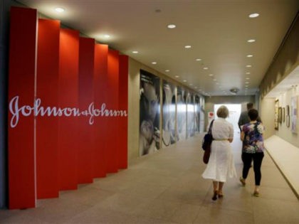 FILE - In this July 30, 2013, file photo, people walk along a corridor at the headquarters of Johnson & Johnson in New Brunswick, N.J. Amid the storm over soaring medicine prices, health care giant Johnson & Johnson says that beginning in February 2017 the company will disclose average increases …