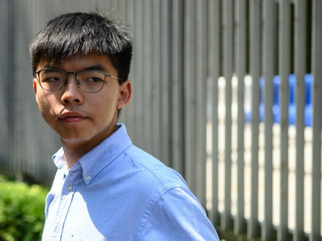 Pro democracy activist and South Horizons Community Organiser Joshua Wong stands in front of the Central Government Complex before the announcement of his run for 2019 District Council elections in Hong Kong on September 28, 2019 (Photo by Philip FONG / AFP) (Photo credit should read PHILIP FONG/AFP/Getty Images)