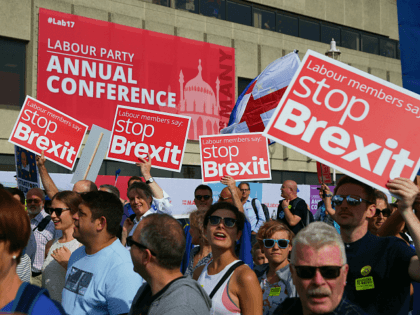 Protesters march along the seafront holding placards and waving European and Union flags in Brighton on September 24, 2017, on a march against Brexit. Britain's revitalised Labour opposition kicks off its annual conference today with leader Jeremy Corbyn set to lay out his party's agenda, free from the leadership challenges …