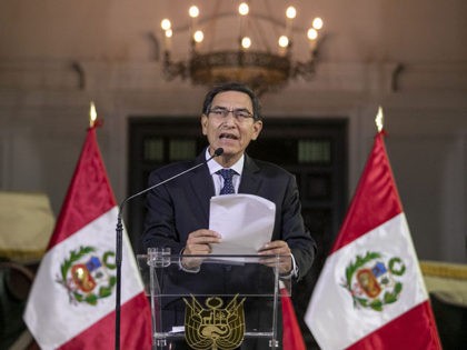 In this photo provided by the Peruvian presidential press office, Peru's President Martin Vizcarra delivers a national message from the government palace in Lima, Peru, Monday, Sept. 30, 2019. Vizcarra announced he had dissolved his nation’s opposition-controlled congress amid a bitter feud over his fight to curb corruption. (Andres Valle/Peruvian …