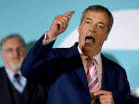 CAMBORNE, ENGLAND - OCTOBER 14: Leader of the Brexit Party, Nigel Farage addresses the audience at The Brexit Party rally at Carn Brea Leisure Centre, on October 14, 2019 in Camborne, England. The Brexit Party rally is part of a nationwide ‘We Are Ready’ tour ahead of a General Election. …