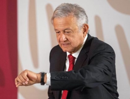 Obrador checks watch (Pedro Pardo / AFP / Getty)