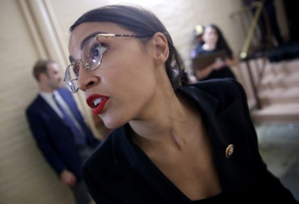 WASHINGTON, DC - SEPTEMBER 24: Rep. Alexandria Ocasio-Cortez (D-NY) answers questions from reporters while entering a House Democratic caucus meeting at the U.S. Capitol where formal impeachment proceedings against U.S. President Donald Trump were announced by Speaker of the House Nancy Pelosi September 24, 2019 in Washington, DC. Pelosi announced …