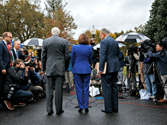 Speaker of the House Nancy Pelosi of Calif., center, Senate Minority Leader Sen. Chuck Sch