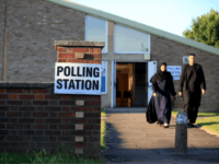 Constituents arrive to cast their votes at the Christ the Carpenter church Hall in Peterborough, England on June 6, 2019. - A local by-election was triggered when Peterborough's former MP Fiona Onasanya was sacked by her constituents in the first successful re-call petition prompting a by-election. (Photo by Lindsey Parnaby …