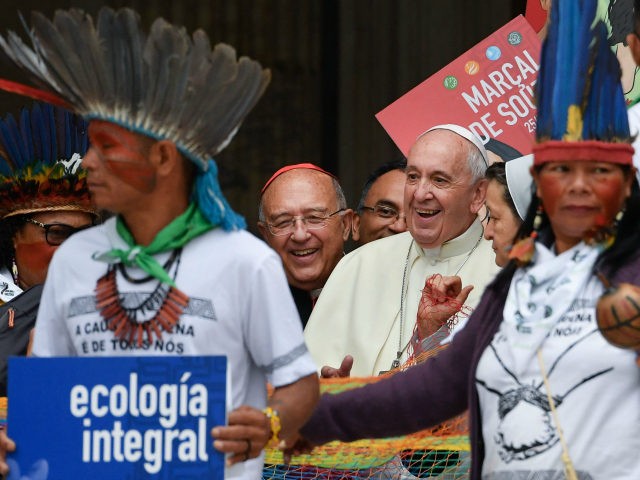 Representatives of the Amazon Rainforest's ethnic groups, Catholic prelates, Peruvian Cardinal Pedro Ricardo Barreto (Rear C) and Pope Francis (C-R) march in procession during the opening of the Special Assembly of the Synod of Bishops for the Pan-Amazon Region on October 7, 2019 outside St. Peter's Basilica in the Vatican. …