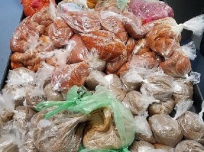 CBP agriculture specialists and officers intercepted plastic bags containing 66 pounds of pork, 33 pounds of raw poultry and a personal use quantity of heroin during an examination of a passenger vehicle at Juarez- Lincoln Bridge. (Photo: U.S. Customs and Border Protection/Laredo Sector)