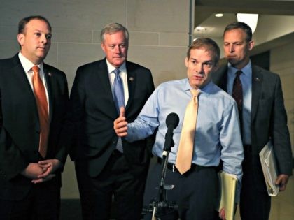 WASHINGTON, DC - OCTOBER 03: Rep. Jim Jordan (R-OH) (2R) speaks to the media while flanked