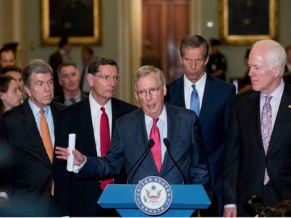 Senate Majority Leader Mitch McConnell, accompanied by Republican members of the Senate, s