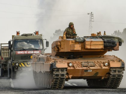A Turkish army tank moves towards the Syrian border on October 18, 2019 in Ceylanpinar, Tu