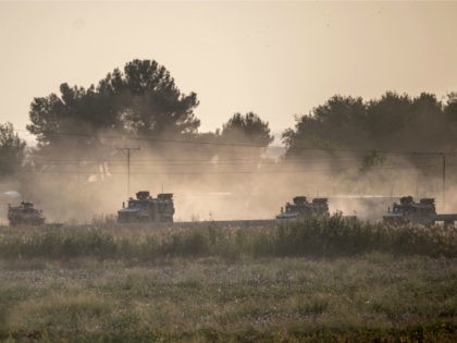 Turkish army vehicles drive towards the Syrian border near Akcakale in Sanliurfa province on October 9, 2019. - Turkey launched an assault on Kurdish forces in northern Syria on October 9 with air strikes and artillery fire reported along the border. The Turkish President announced the start of the attack …