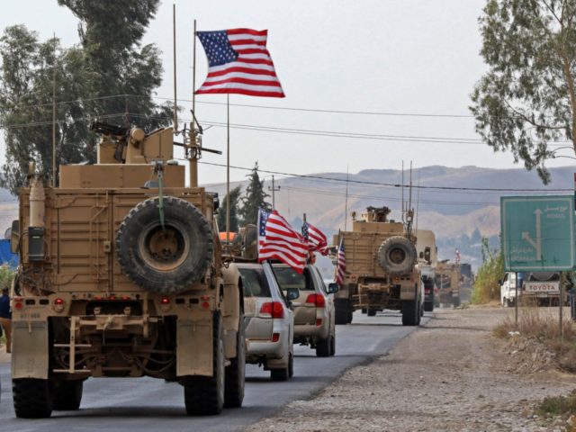 A convoy of US military vehicles arrives near the Iraqi Kurdish town of Bardarash in the Dohuk governorate after withdrawing from northern Syria on October 21, 2019. (Photo by SAFIN HAMED / AFP) (Photo by SAFIN HAMED/AFP via Getty Images)