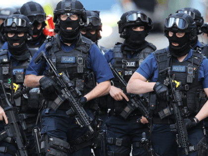 LONDON, ENGLAND - JUNE 04: Counter terrorism officers march near the scene of last night's