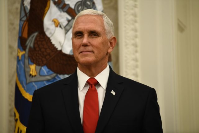 US Vice President Mike Pence listens as US President Donald J. Trump welcomes Roger S. Pen