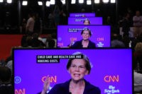 WESTERVILLE, OHIO - OCTOBER 15: Sen. Elizabeth Warren (D-MA) appear on television screens in the Media Center during the Democratic Presidential Debate at Otterbein University on October 15, 2019 in Westerville, Ohio. A record 12 presidential hopefuls are participating in the debate hosted by CNN and The New York Times. …