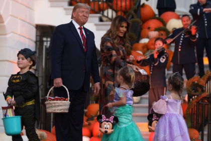 WASHINGTON, DC - OCTOBER 28: U.S. President Donald Trump and first lady Melania Trump han