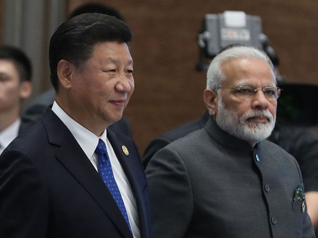 (L to R) Chinese President Xi Jinping and Indian Prime Minister Narendra Modi attend the Dialogue of Emerging Market and Developing Countries on the sidelines of the 2017 BRICS Summit in Xiamen, southeastern China's Fujian Province on September 5, 2017.