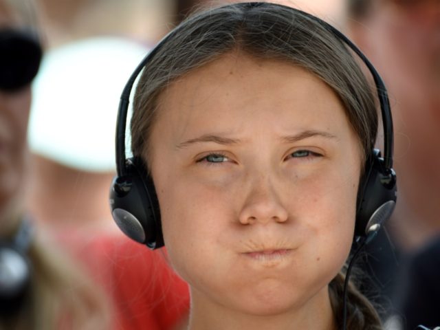 Swedish climate activist Greta Thunberg reacts as she listens to her headphones before the 2019 Normandy 'Freedom prize' award ceremony on July 21, 2019 in Caen, Western France. (Photo by Jean-Francois MONIER / AFP) (Photo credit should read JEAN-FRANCOIS MONIER/AFP/Getty Images)