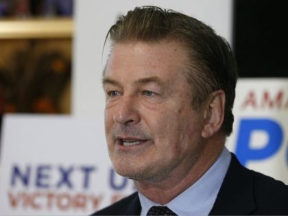 Actor Alec Baldwin, speaks to supporters of Amanda Pohl, candidate for Virginia Senate District 11 in her home in Midlothian, Va., Tuesday, Oct. 22, 2019. Baldwin campaigned for several candidates around the state. (AP Photo/Steve Helber)