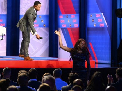 A transgendered woman audience member gives the microphone back to moderator Don Lemon during a town hall devoted to LGBTQ issues hosted by CNN and the Human rights Campaign Foundation at The Novo in Los Angeles on October 10, 2019. (Photo by Robyn Beck / AFP) (Photo by ROBYN BECK/AFP …
