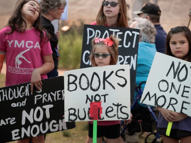ROUND ROCK, TX - MARCH 24: Children participate in a March for Our Lives rally on March 24