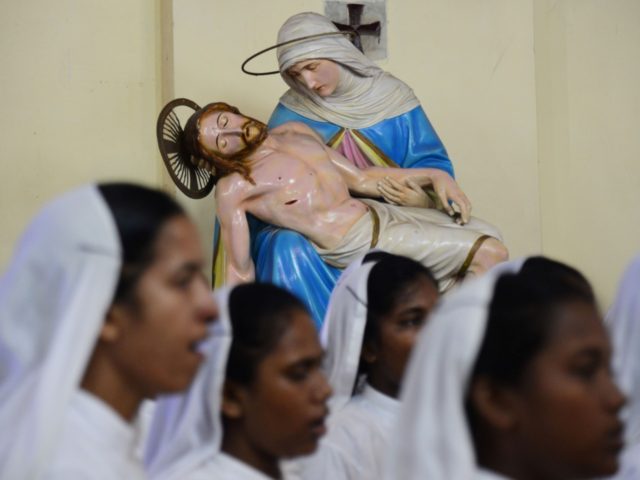 Indian Roman Catholic nuns of the Missionaries of Charity order attend a mass to announce St. Teresa of Calcutta a 'co-patron' of the archdiocese at the Cathedral of the Most Holy Rosary in Kolkata on September 6, 2017. Pope Francis on September 4, 2016 proclaimed Mother Teresa a saint, hailing …