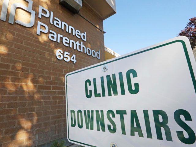 In this Aug. 21, 2019, file photo, a sign is displayed at Planned Parenthood of Utah in Salt Lake City. An appeals court is considering whether to block a Trump administration rule that bans taxpayer-funded health clinics from referring patients for an abortion, a rule that has already prompted many …